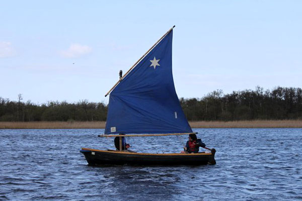 Well-helmed dinghy on Barton Broad