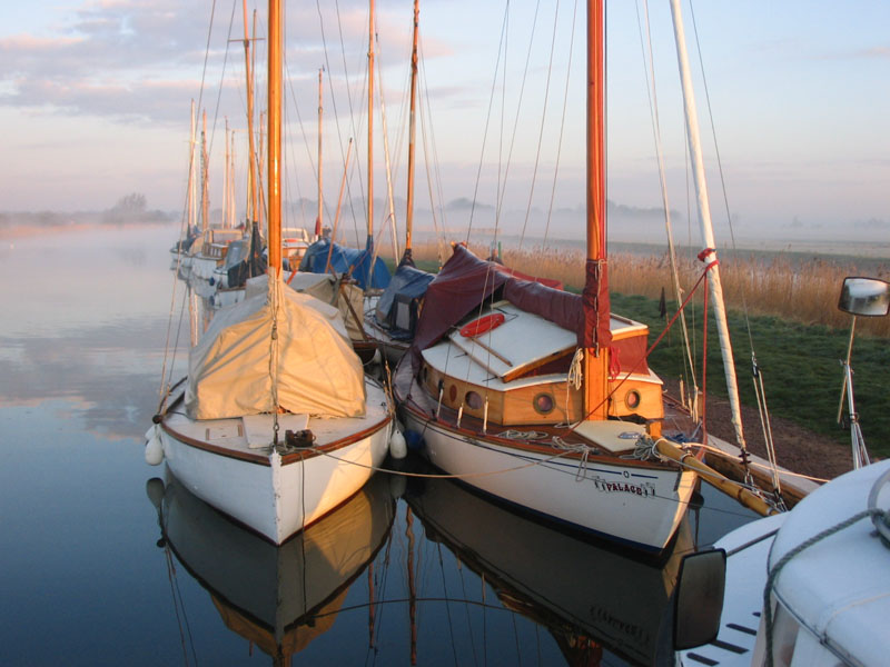 Boats moored on a misty morning
